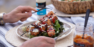 BBQ chicken skewers and grilled salad