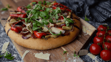 Spicy Catalan-inspired pizza made with healthy ingredients and fresh vegetables. Spicy catalan-inspired pizza made with healthy and fresh ingredients.